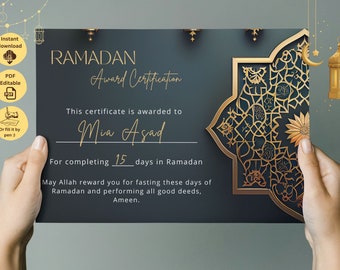 May include: A printable Ramadan Award Certificate with a gold and blue design. The certificate reads "This certificate is awarded to Mia Asad for completing 15 days in Ramadan. May Allah reward you for fasting these days of Ramadan and performing all good deeds, Ameen."