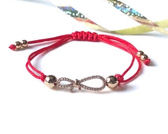 Bracelet rouge de corde avec la forme de ruban