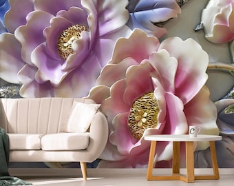 May include: A beige sofa with a dark green throw blanket, a round wooden side table with a white mug featuring the letter C, and a large wall mural depicting oversized, three-dimensional purple and pink flowers with gold-toned centers.