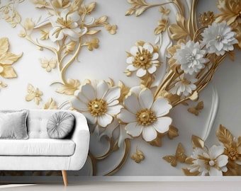 May include: A white sofa with two gray pillows sits in front of a wall mural. The mural features a 3D floral design with white flowers, gold accents, and butterflies. The flowers have gold centers.