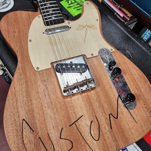Customized wood pickguard. Please purchase only if we have already had conversation about a custom pickguard for your guitar!