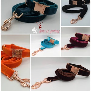 May include: A collage of velvet dog collars and leashes in various colors, including teal, black, orange, turquoise, burgundy, and brown. Each set features a matching collar and leash with rose gold hardware, including a buckle and a leash clip. The phrase "love is giving" is in the image.