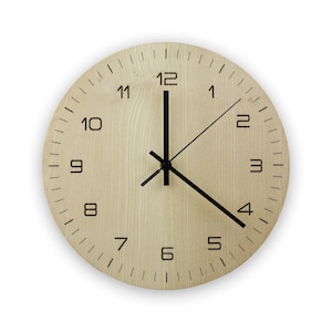 May include: A round wooden clock with black hands and black numbers on a white background. The clock is set to 12:00.