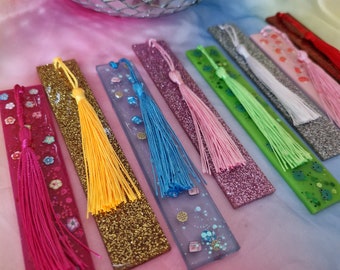 Handmade glitter bookmarks. Sparkly resin. Frogs, mushrooms, cookies, flowers with tassels. Kitsch kawaii harajuku style.