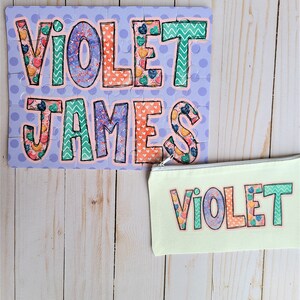 May include: A personalized puzzle with the names "Violet James" in colorful patterned letters on a purple background. A matching zippered pouch with the name "Violet" in colorful patterned letters on a light green background.