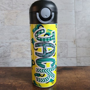 May include: A yellow water bottle with a black lid and a green and white design of tractors and the word "Gage".