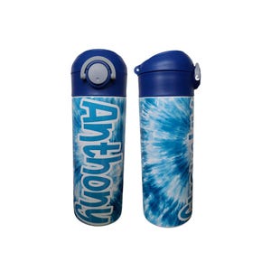 May include: Two blue and white water bottles with a tie-dye pattern. One bottle has the name "Anthony" written on it in blue.