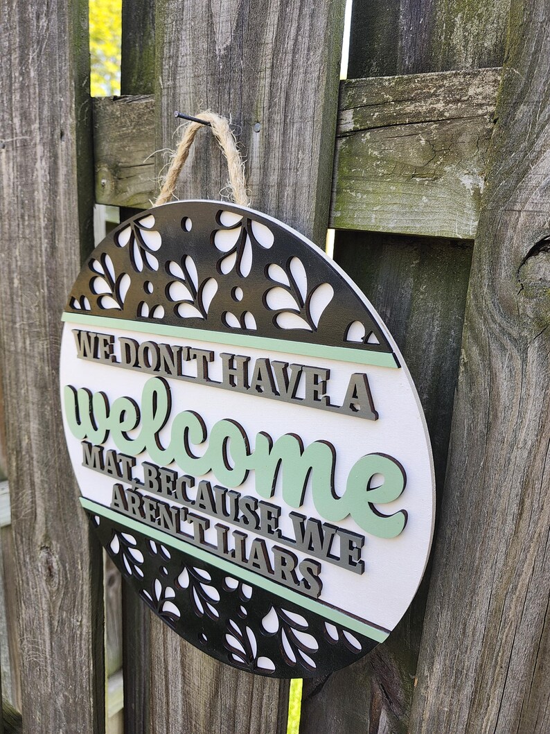 Witty Door Hanger, Funny Door Sign, We Don't Have a Welcome Mat Because ...
