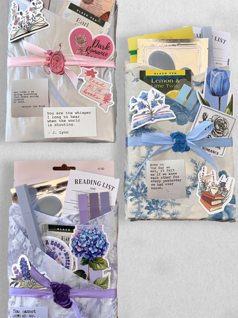May include: Three wrapped gifts with decorative stickers and ribbons. The gifts are adorned with floral and book-themed stickers, tea bags, and quotes. Each gift is wrapped in different patterned paper and tied with a ribbon and wax seal.