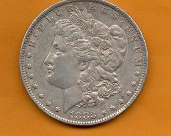 1883 - Srebrny dolar O Morgana w oprawie - w obiegu, ma ponad 140 lat