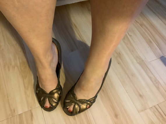 Well worn distressed Gold peep toe heels