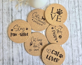 Set of 6 cork coasters for cat lovers with cute cat motifs and sayings, a great gift for cat fans, cat moms, and cat dads.