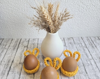 Hand-crocheted egg cup made of cotton, yellow, decorative Easter egg holder with ears