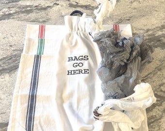Plastic Bag Holder: "Bags Go Here" embroidered on a flour sack towel.