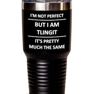 May include: Black stainless steel tumbler with white text that reads "I'm not perfect but I am Tlingit. It's pretty much the same."