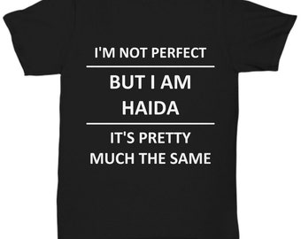May include: Black t-shirt with white text that reads "I'm not perfect but I am Haida. It's pretty much the same."