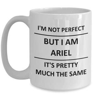 May include: White ceramic coffee mug with black text that reads "I'm not perfect but I am Ariel it's pretty much the same".