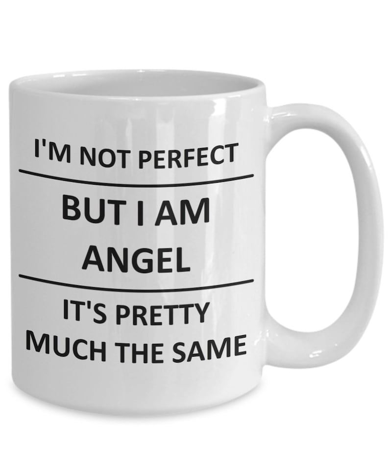 May include: White ceramic coffee mug with black text that reads "I'm not perfect but I am angel it's pretty much the same".