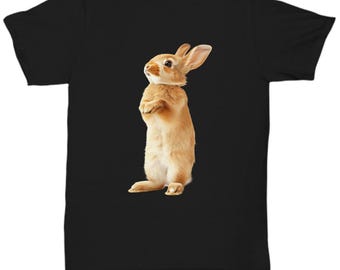 May include: A black t-shirt with a brown rabbit standing on its hind legs. The rabbit is looking up and has its paws in front of it.
