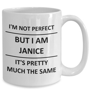 May include: White ceramic coffee mug with black text that reads "I'm not perfect but I am Janice it's pretty much the same."