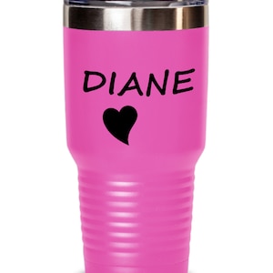 May include: A pink stainless steel tumbler with a black heart and the name "DIANE" printed on it.