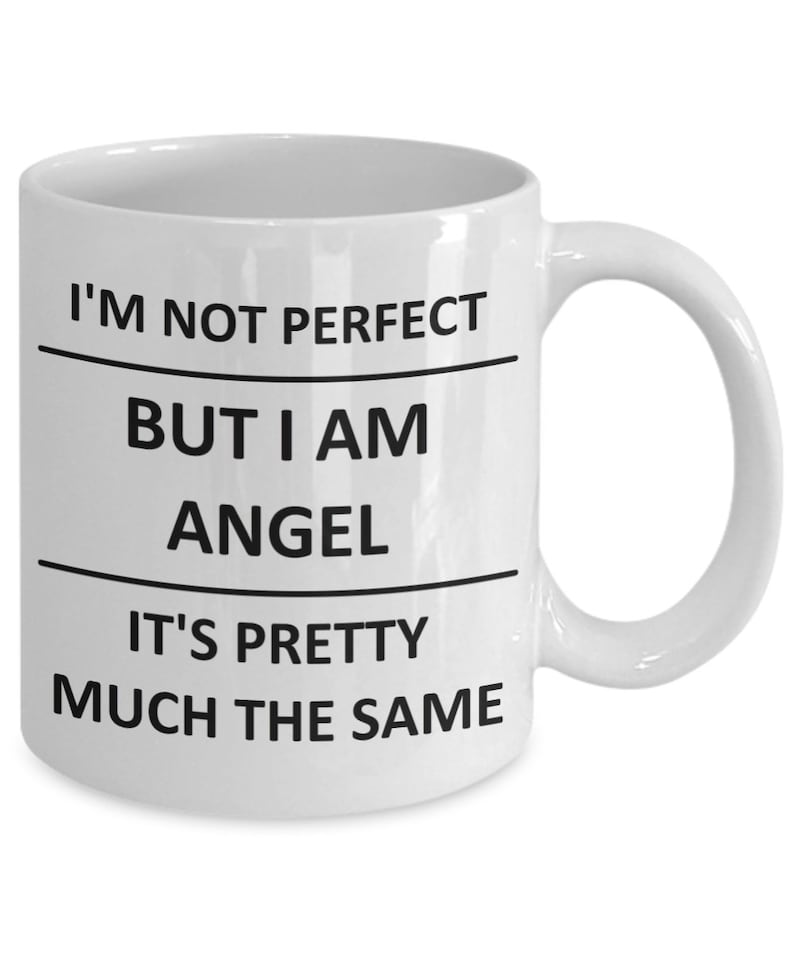 May include: White ceramic coffee mug with black text that reads "I'm not perfect but I am angel it's pretty much the same".
