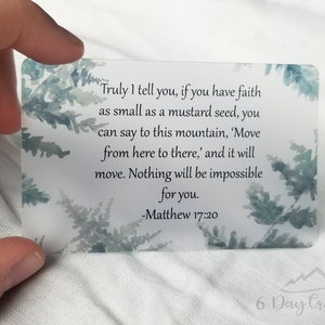 May include: A white card with a watercolour background of blue and green ferns. The card features a quote from the Bible, Matthew 17:20, which reads: "Truly I tell you, if you have faith as small as a mustard seed, you can say to this mountain, 'Move from here to there,' and it will move. Nothing will be impossible for you." The card is printed with the text "6 Day Creations" in the bottom right corner.