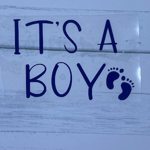 May include: It's a Boy!  A blue vinyl decal with the text "It's a Boy" and two blue baby footprints.