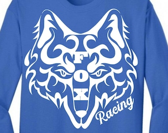 May include: A royal blue long-sleeved t-shirt with a white stylized fox head graphic and the text "FOX Racing" printed on the front.