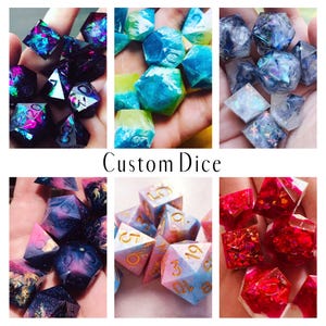 May include: A collection of six sets of custom polyhedral dice in various colors and finishes, including dark purple with glitter, blue and green swirls, iridescent white, pink and blue gradients with gold numbers, and vibrant red with foil flakes.