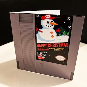 Cartão de Natal Retro Gaming - Design de cartucho NES boneco de neve