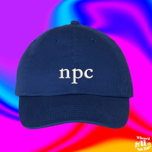 May include: A navy blue baseball cap with white embroidered text that says "npc".