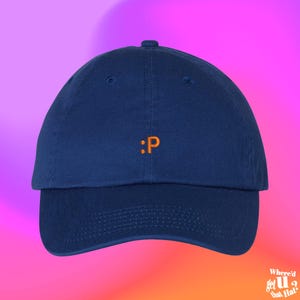 May include: A navy blue baseball cap with an orange embroidered colon and letter "P" on the front.