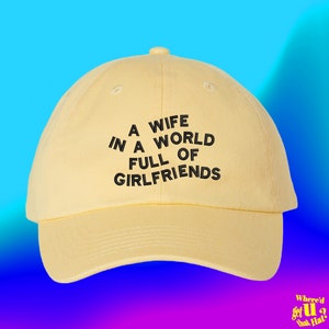 A Wife In A World Full Of Girlfriends Hat Stocking Filler For Husband Marriage Spouse Custom Color Adjustable Embroidered Dad Hat
