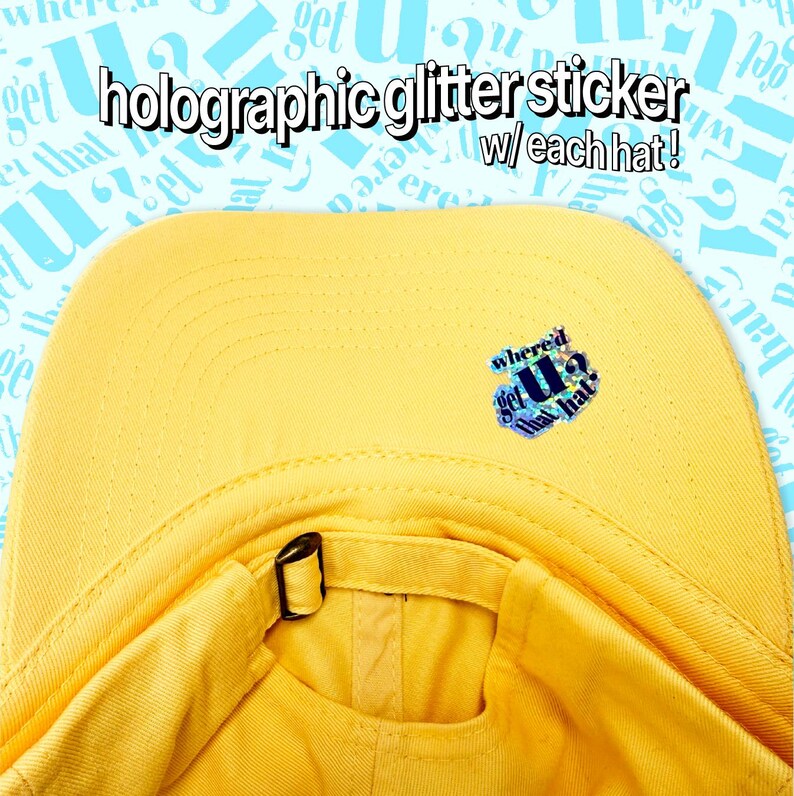A yellow baseball cap with a small blue sticker on the front.
