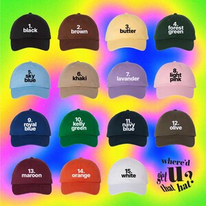 a collection of 16 different colored baseball caps, each with a unique color and style, arranged in a grid against a colorful gradient background.