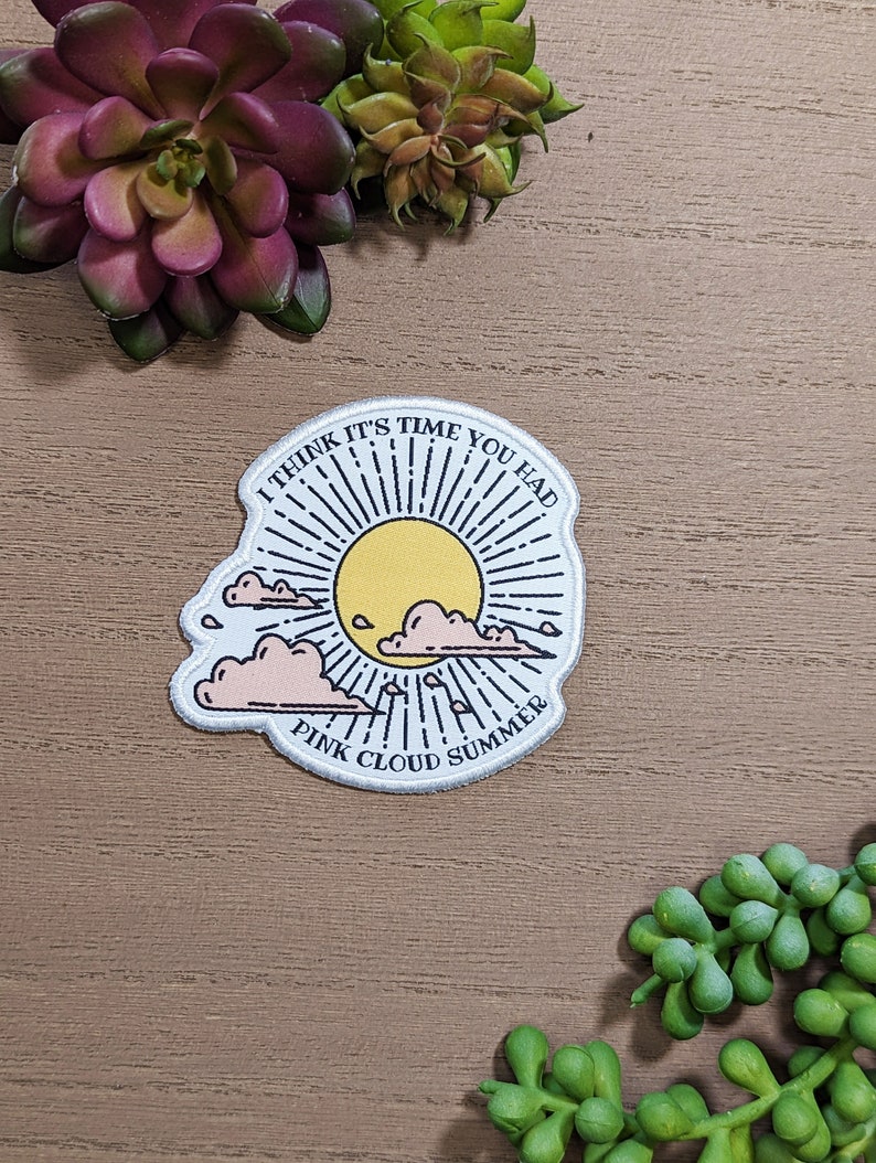 May include: White embroidered patch with a sun, clouds, and the text "I think it's time you had Pink Cloud Summer".