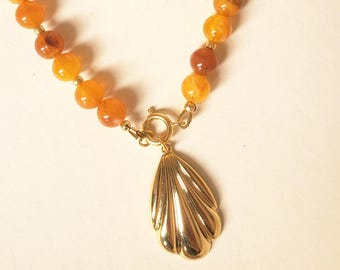 Marbled resin bead necklace and gold shell pendant