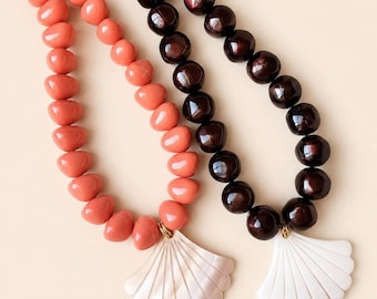 Resin bead necklace and mother-of-pearl shell pendant