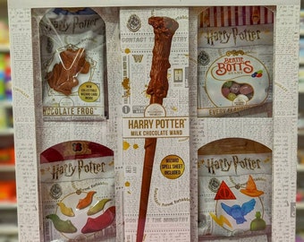 Harry Potter Gift Box Set. Includes: Chocolate Frog & Wand, Candy Slugs, Magical Sweets and Bertie Botts Jelly Beans.