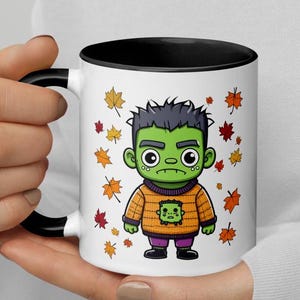 Grumpy Frankenstein Fall Mug| Frankenstein in Sweater Mug| Frankenstein Mug| Cute Halloween Mugs| Spooky Season mugs| Cute Frankenstein Mug|