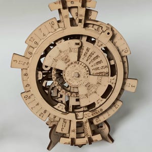 May include: A wooden perpetual calendar with a circular design. The calendar features a rotating dial with numbers 1 through 12, and a smaller dial with the days of the week. The calendar also has a dial for the month and year. The calendar is made of natural wood and has a rustic look.