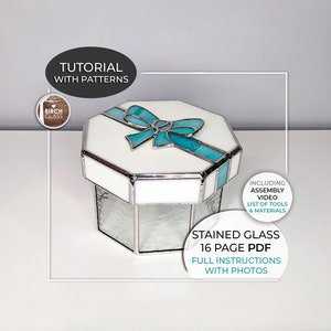 May include: A stained glass hexagonal box with a white base and a turquoise bow on top. The box is made of glass and has a silver frame. The image includes the text "Stained Glass 16 Page PDF Full Instructions with Photos".
