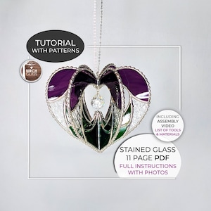 May include: A stained glass heart-shaped suncatcher with purple, green, and white glass pieces. The suncatcher is hanging from a silver chain and includes an assembly video, list of tools, and materials. The listing is for an 11-page PDF with full instructions and photos.