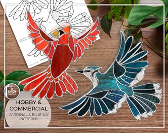 May include: Two stained glass bird patterns, a cardinal and a blue jay, with instructions for hobby and commercial use. The patterns are printed on white paper with black lines.