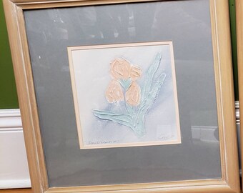 May include: A framed print of a pastel pink and green floral design with the artist's signature "Daniel" in the bottom right corner and the text "Limited Edition" in the bottom left corner.