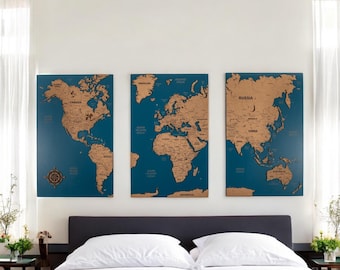 May include: Three blue and brown world maps with cork surfaces, mounted on a white wall above a gray headboard and white bedding.