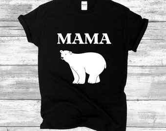 May include: Black t-shirt with a white polar bear and the word "MAMA" printed on it.