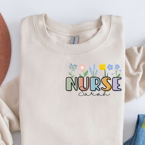 Nursing Shirt Wildflowers, Personalized Nurse Sweatshirt, Retro Nursing Sweater, Nurse Graduation Gifts, Registered Nurse RN Nurse Crewneck