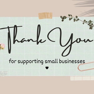 May include: A light blue card with a grid pattern and the text "Thank You for supporting small businesses" with a small black heart symbol. The card is surrounded by pink flowers, green leaves, and a gold paper clip.
